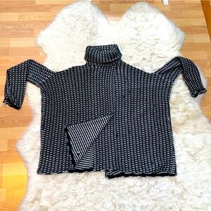Dramatically swingy designer novelty sweaterknit turtleneck cape